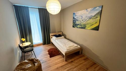 Una cama o camas en una habitación de Nest Natur Hostel