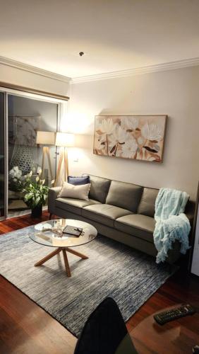 a living room with a couch and a coffee table at Capel Sands Beachfront Apartment in Capel Sound
