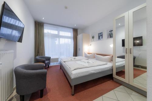 Postel nebo postele na pokoji v ubytování Strandläufer 117