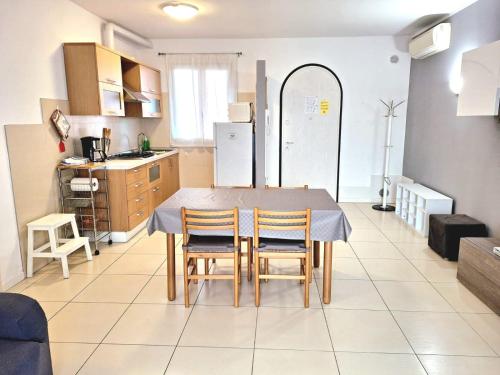a kitchen and dining room with a table and chairs at Super Location front lake in Sirmione