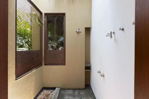 a hallway of a house with a window at Astonishing 5BR Villa at Mesa de Yeguas in Anapoima