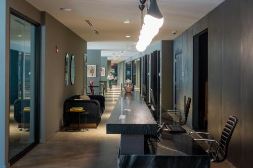 a hallway with a long table in a room at Luxury Apartments by Hyatus at The Asher in Stamford