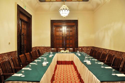 a large conference room with a long table and chairs at Faisalabad Serena Hotel in Faisalabad