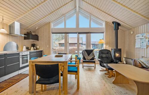 a kitchen and dining room with a table and chairs at Beautiful Home In Gørlev With Wifi in Gørlev