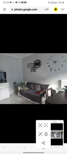 a picture of a living room with a couch at HL residence in Wronki