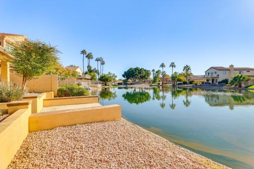 a body of water with houses and palm trees at Half-Mi to Dtwn Lakefront Gilbert Home! in Gilbert