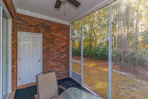 an empty room with a window and a door at Cozy 2BR at Barefoot! Perfect for 4! Unit 414 in North Myrtle Beach