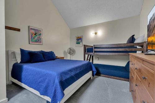 a bedroom with a bed and a bunk bed at Updated Ski In Ski Out Condo Holiday Valley in Ellicottville