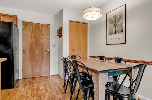 a dining room with a table and chairs at Updated Ski In Ski Out Condo Holiday Valley in Ellicottville