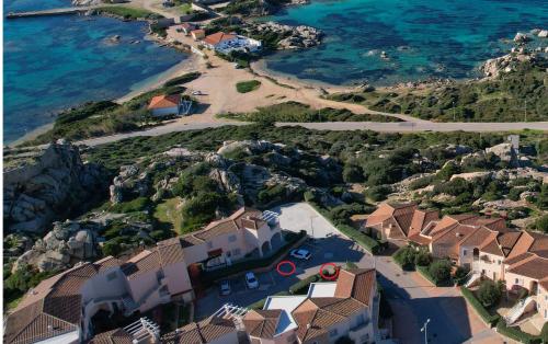 an aerial view of a house next to the ocean at Borgo Punta Tegge il mare la spiaggia il tramonto in La Maddalena