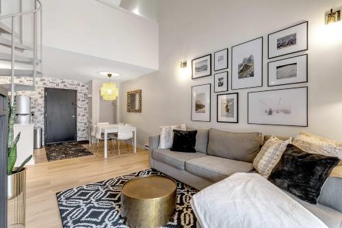 a living room with a couch and a table at Ski In Ski Out 3-bed 2-bath Condo King Bed in Ellicottville