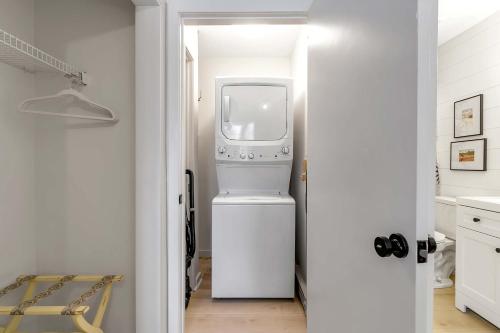 a laundry room with a washer and dryer in it at Ski In Ski Out 3-bed 2-bath Condo King Bed in Ellicottville