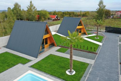 an overhead view of a house with a palm tree at PRIVATE PLACE Avrig adults only in Avrig