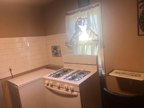 a kitchen with a white stove and a window at BVF2Bedroom in Harrisburg