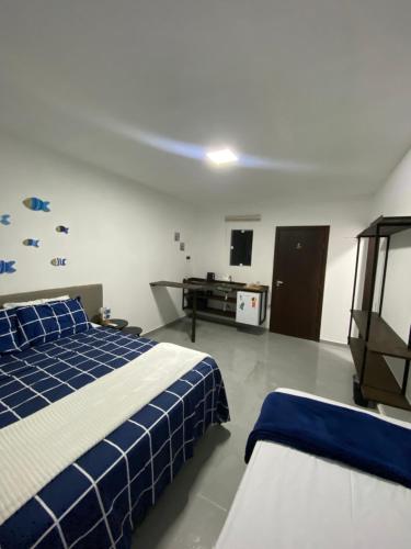 Postel nebo postele na pokoji v ubytování Pousada Tamatoa