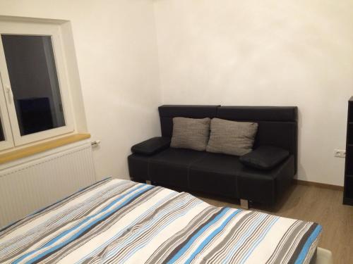 a living room with a couch and a chair at Appartement Luna in Mittersill