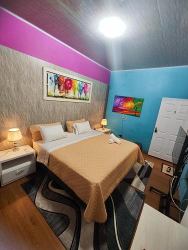 a bedroom with a large bed in a room at Hotel Restaurante LA AZOTEA in El Cerrito
