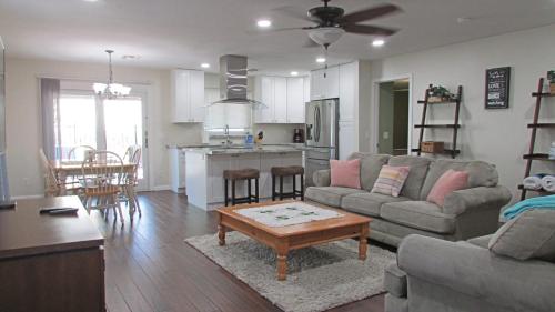 a living room with a couch and a table at Cozy home near freeways w pool BBQ in Peoria