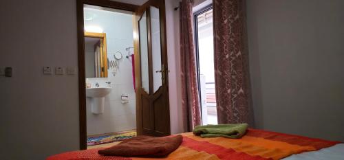 a bedroom with a bed with two towels on it at 3 Floors Villa on Promenade 4 bedrooms 3 bathrooms V1 in Sliema