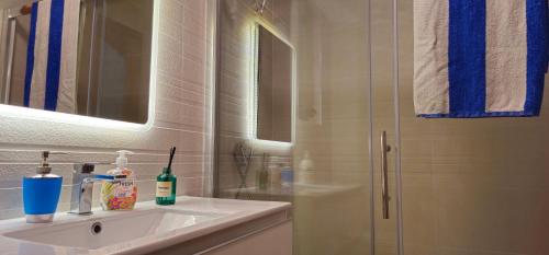 a bathroom with a sink and a shower at 3 Floors Villa on Promenade 4 bedrooms 3 bathrooms V1 in Sliema