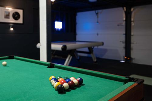 a snooker table with a group of balls on it at Spacious Modern Retreat w Game Room and Yard in Lynnwood