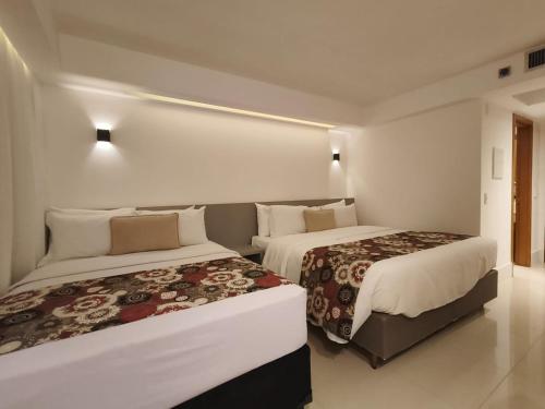 Katil atau katil-katil dalam bilik di Raridade!! Flat Particular de Alto Padrão em Hotel Novíssimo - Cama King Size e Cama de Solteiro - Limpeza Diária Gratuita - Ótimo Preço - Excelente Atendimento - Melhor Localização de Brasília - Dentro do Hotel Ramadã Brasília Alvorada