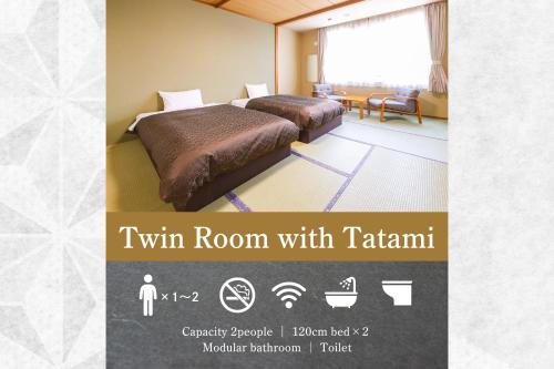 a hotel room with two beds in a room with tarani at Sasai Hotel in Otofuke