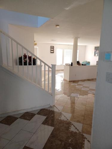 a room with a staircase and a tile floor at Cosi Room Near Austin in Pflugerville