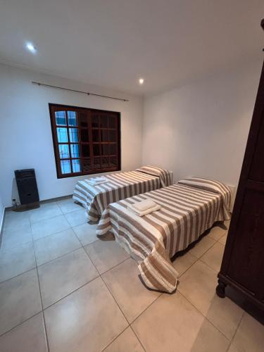 Ένα ή περισσότερα κρεβάτια σε δωμάτιο στο Aires de Areco