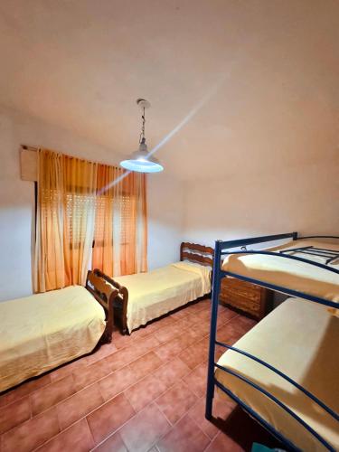 Ένα ή περισσότερα κρεβάτια σε δωμάτιο στο Casa el zorzal Agua de oro