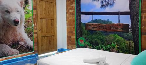 a room with a polar bear poster and a bed at Eco-HOTEL HOGAR EN LA MONTAÑA HOME SWEET HOME in La Vega