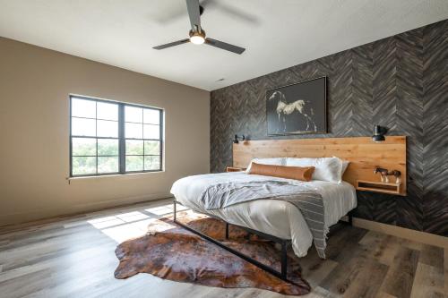 a bedroom with a bed and a ceiling fan at Branson 10 Bedroom Lakeside Lodge! PRIVATE HEATED POOL! in Hollister