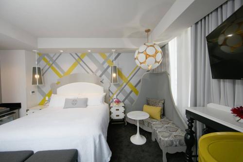 a bedroom with a bed with a soccer ball on the wall at Elyton Hotel, Autograph Collection in Birmingham