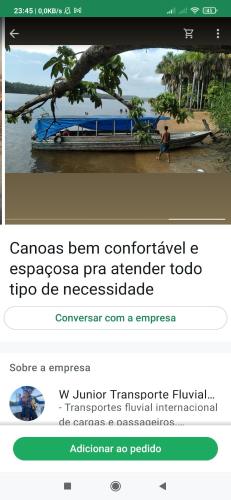 a screenshot of a website with a person on a boat at Wanderley in Oiapoque