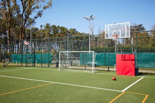 a tennis court with a ball on the court at Paragraph Resort & Spa Shekvetili, Autograph Collection in Shekvetili