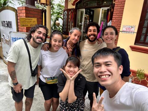 a group of people posing for a picture at Hue Ancient Town - Homestay in Hue in Hue