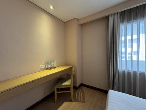 Un ou plusieurs lits dans un hébergement de l'établissement Jinjiang Inn - Ortigas