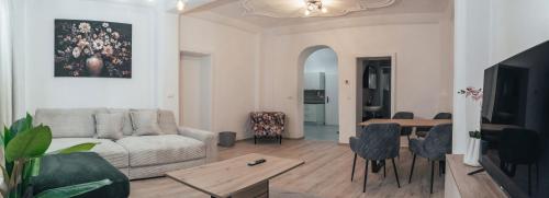 a living room with a couch and a table at Gozzo Woods in Krems an der Donau