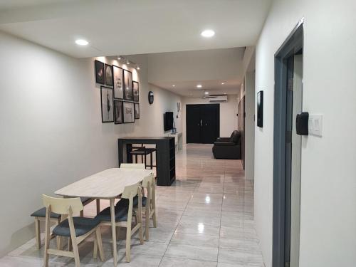 a dining room with a table and chairs at Air Putih Homestay 23 in Kuantan