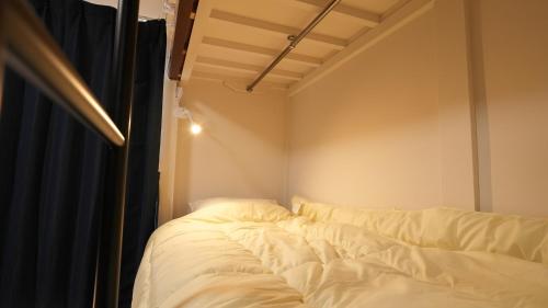 Ein Bett oder Betten in einem Zimmer der Unterkunft Nazuki
