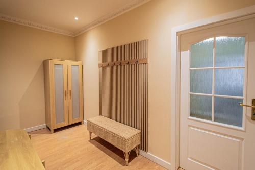 a room with a bench and a window and a door at Radost Residence The Heart of Unique Living in Prague