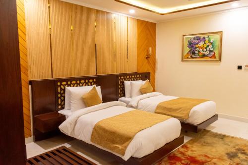 Cama o camas de una habitación en Hotel Tourmaline Peshawar
