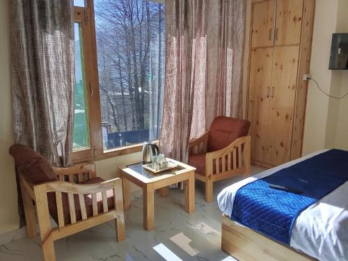 Postel nebo postele na pokoji v ubytování SkyWay HomeStay