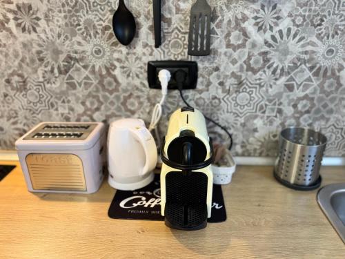 a coffee maker sitting on top of a counter at Tommy's Home in Turin