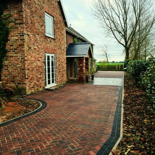 a brick driveway in front of a brick house at Three Farthings in Cranswick