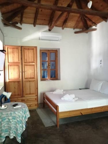 Postel nebo postele na pokoji v ubytování Penelope Apartments