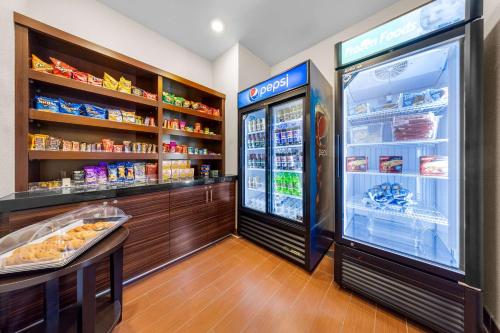 a store with an open refrigerator in a store at Sleep Inn & Suites West-Near Medical Center in Rochester