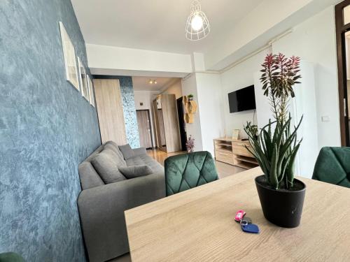 a living room with a table and a couch at Premier Luxury Lazar Residence by TOD Apartments in Iaşi
