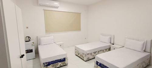 Postel nebo postele na pokoji v ubytování عمارة دانة بنت أحمد Dana Bint Ahmed