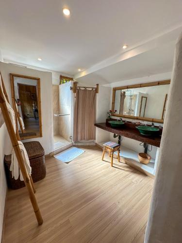 a room with a bathroom with a sink and a mirror at Phu Chaisai Chiang Rai Mountain Resort in Mae Salong Nai